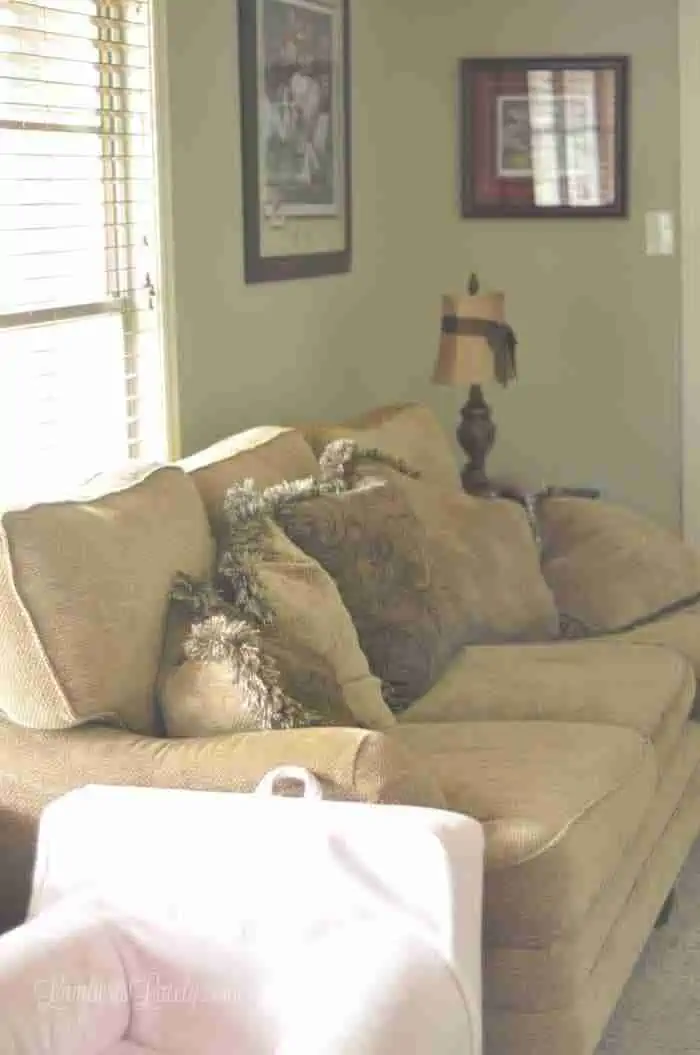 beige couch in front of a window.