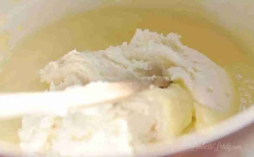 folding whipped cream into pudding mix.