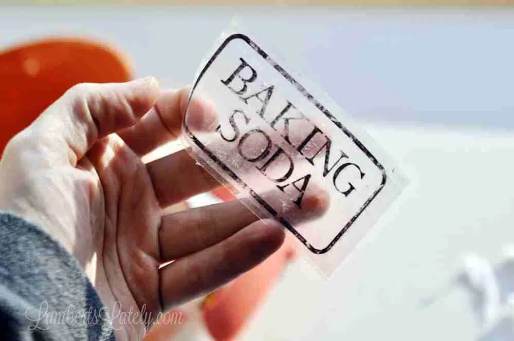holding a clear baking soda label.