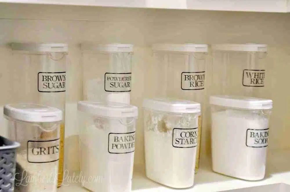 clear canisters labeled with clear pantry labels.