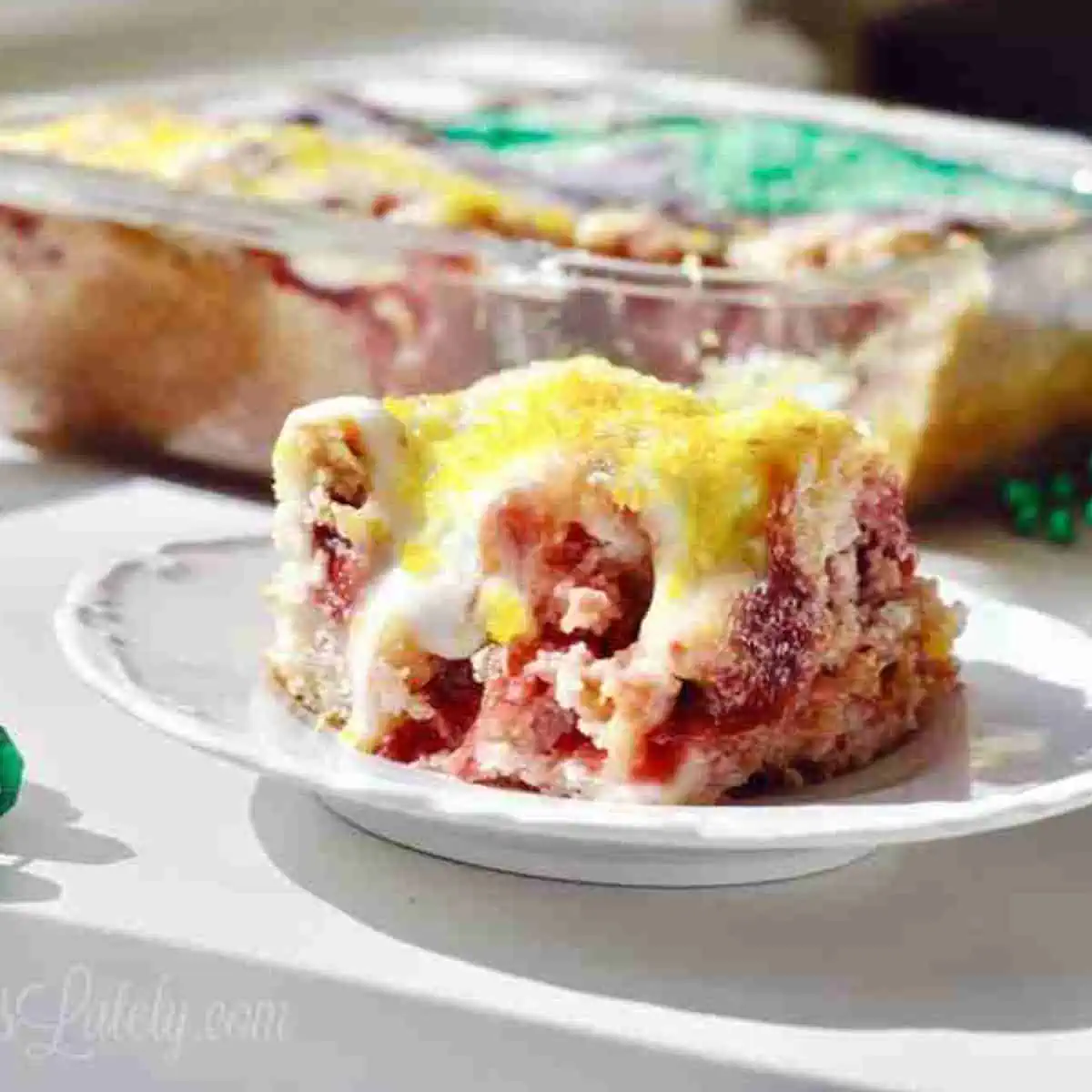 slice of king cake earthquake cake on a plate.