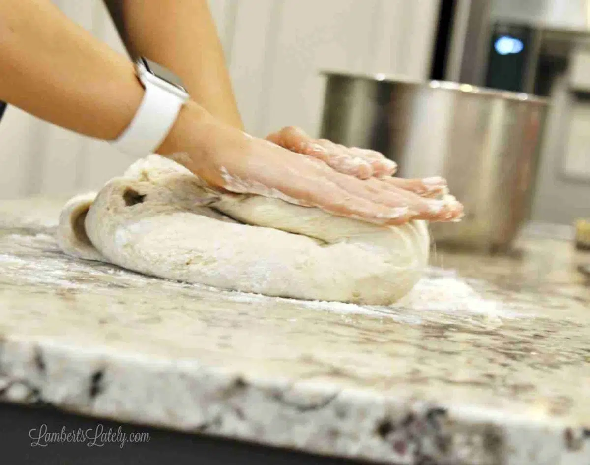 kneading cinnamon roll dough.