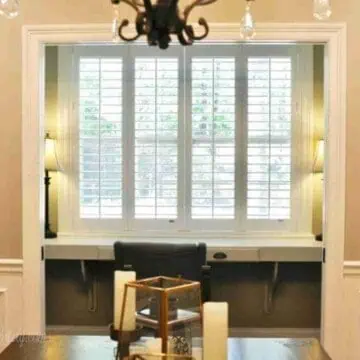 plantation shutters on a large office window.