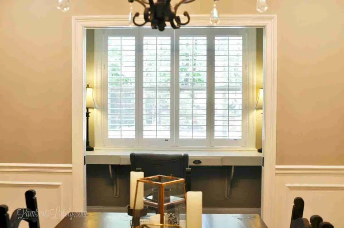 plantation shutters on a large office window.