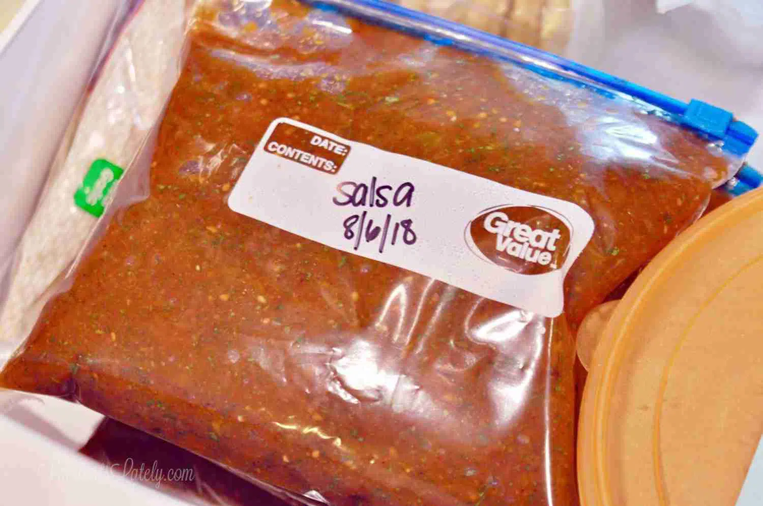 bagged salsa in a freezer.