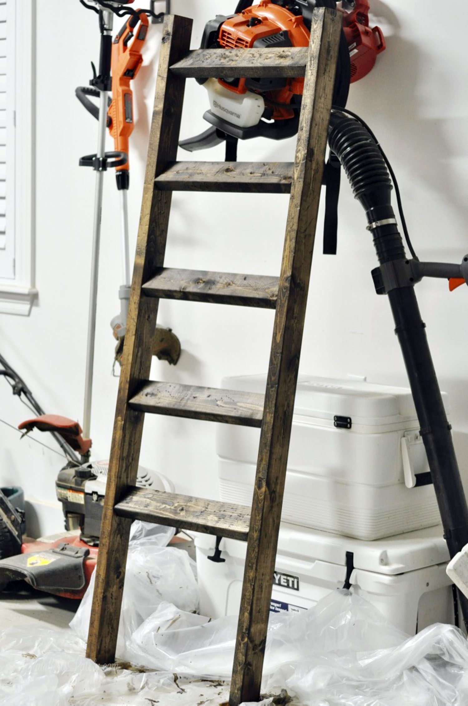 finished diy blanket ladder in a garage.