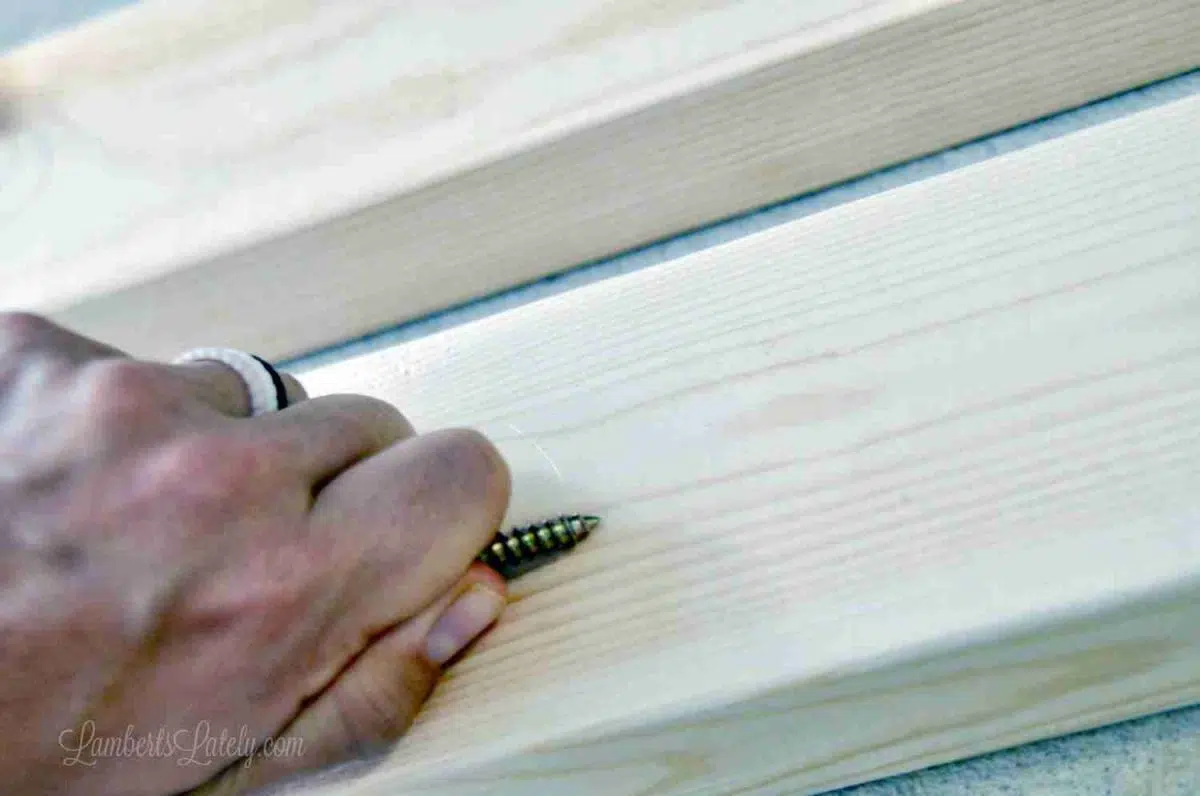 scraping 2x4 with a screw.