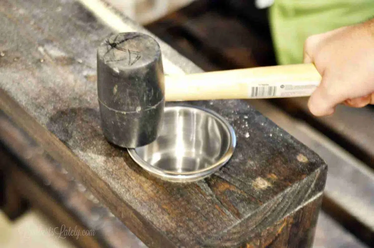 using a rubber mallet to put in cup holders.