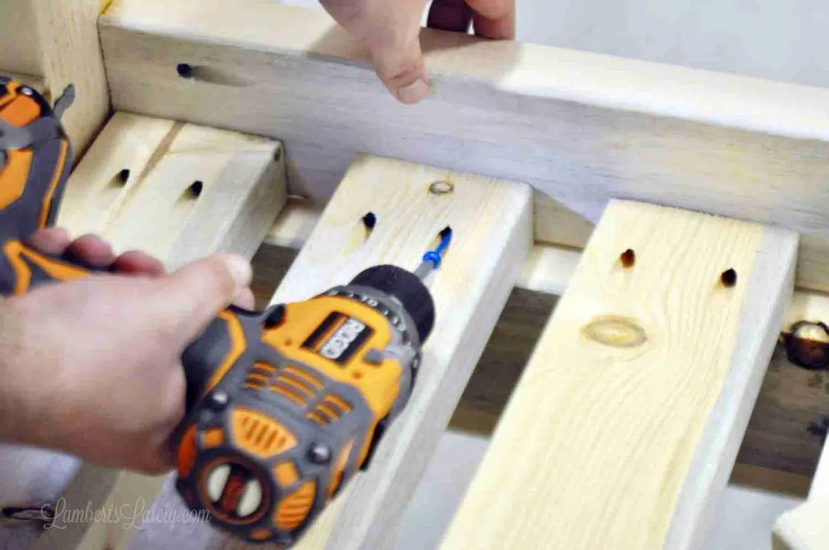 drilling screws into sectional to attach parts.
