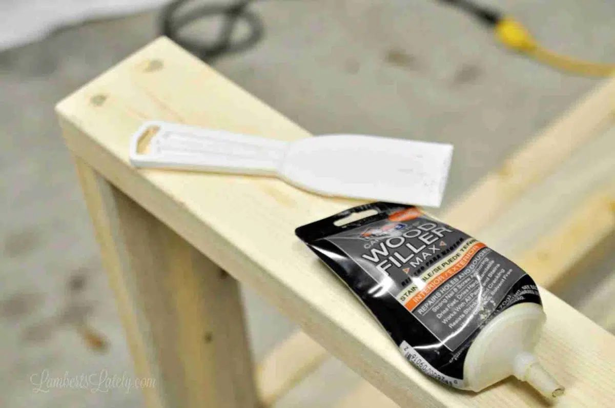 wood putty and putty knife lying on the sectional