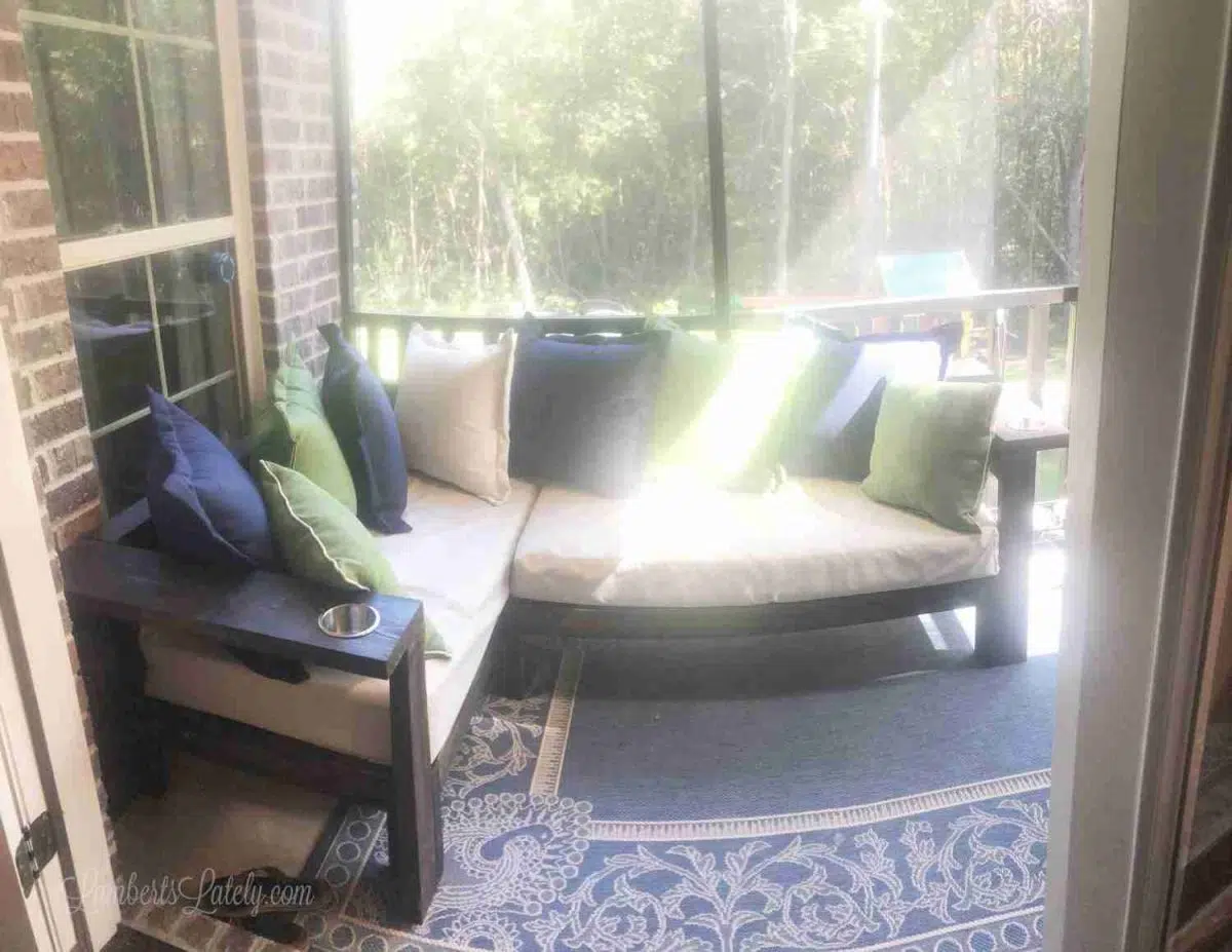 outdoor sectional sofa on a screened porch.