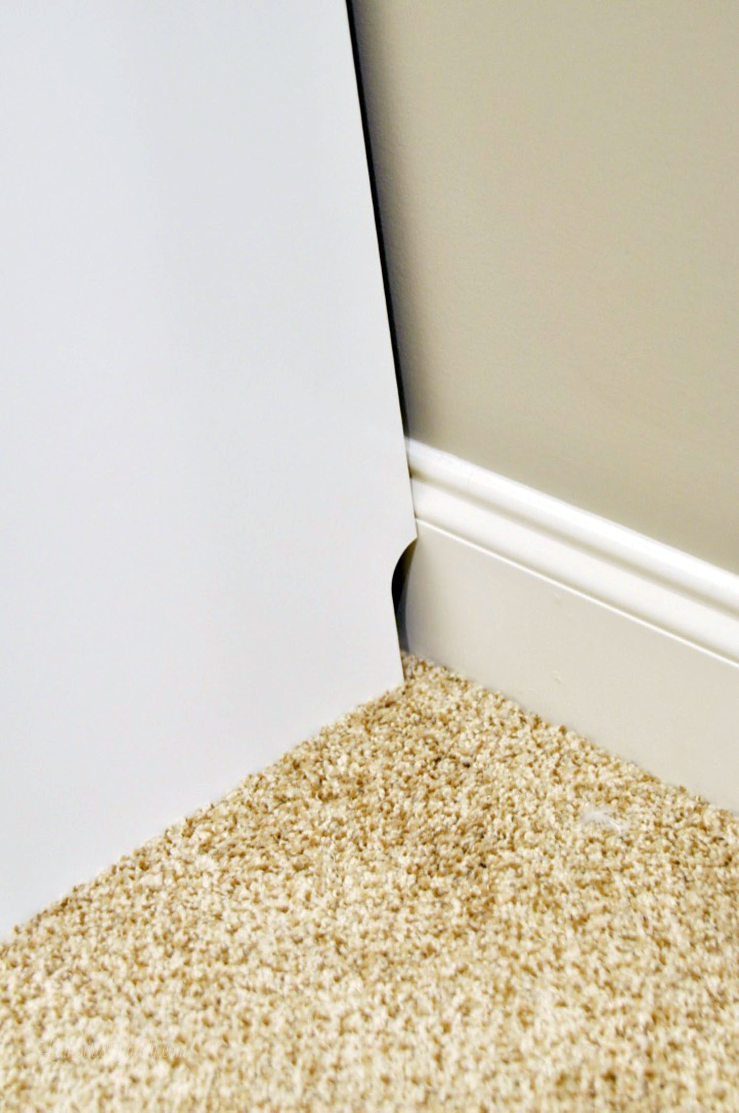 gap in back of cabinet not high enough to fit baseboard.
