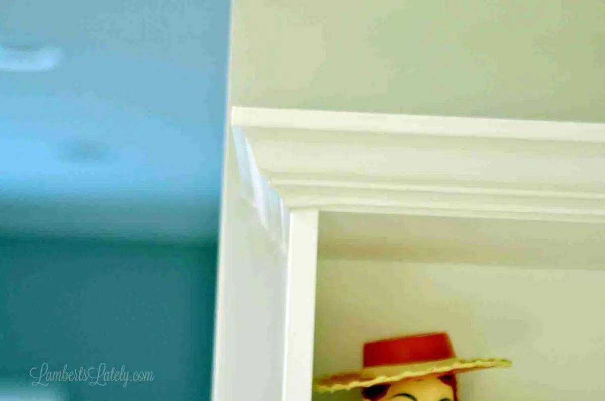 corner of crown molding on a shelf.