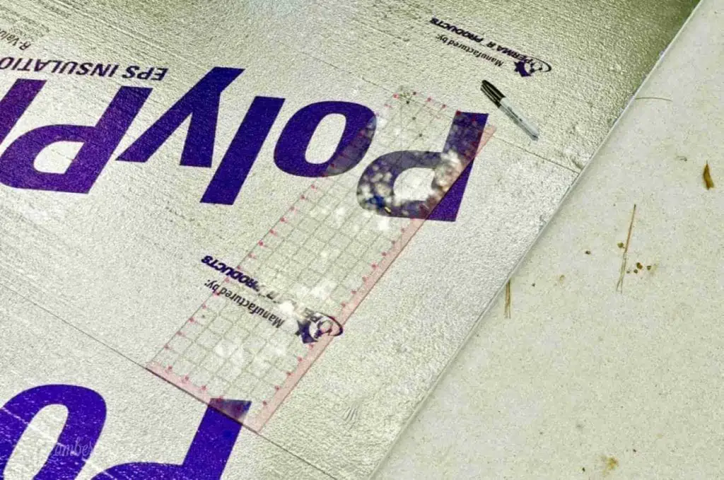 quilting ruler on top of foam board.