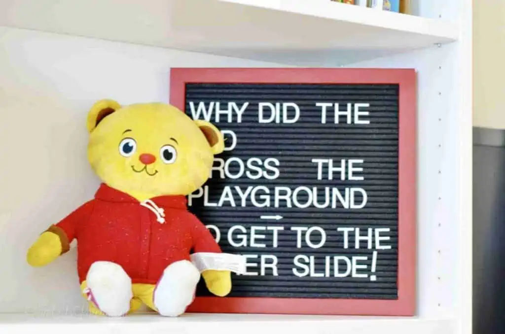 letter board, stuffed animal on a shelf.