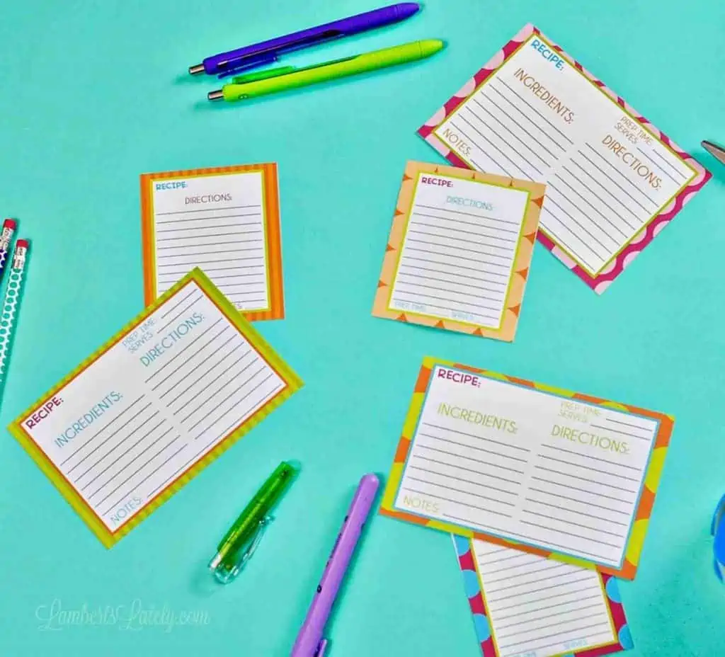 recipe cards and office supplies on a blue background.
