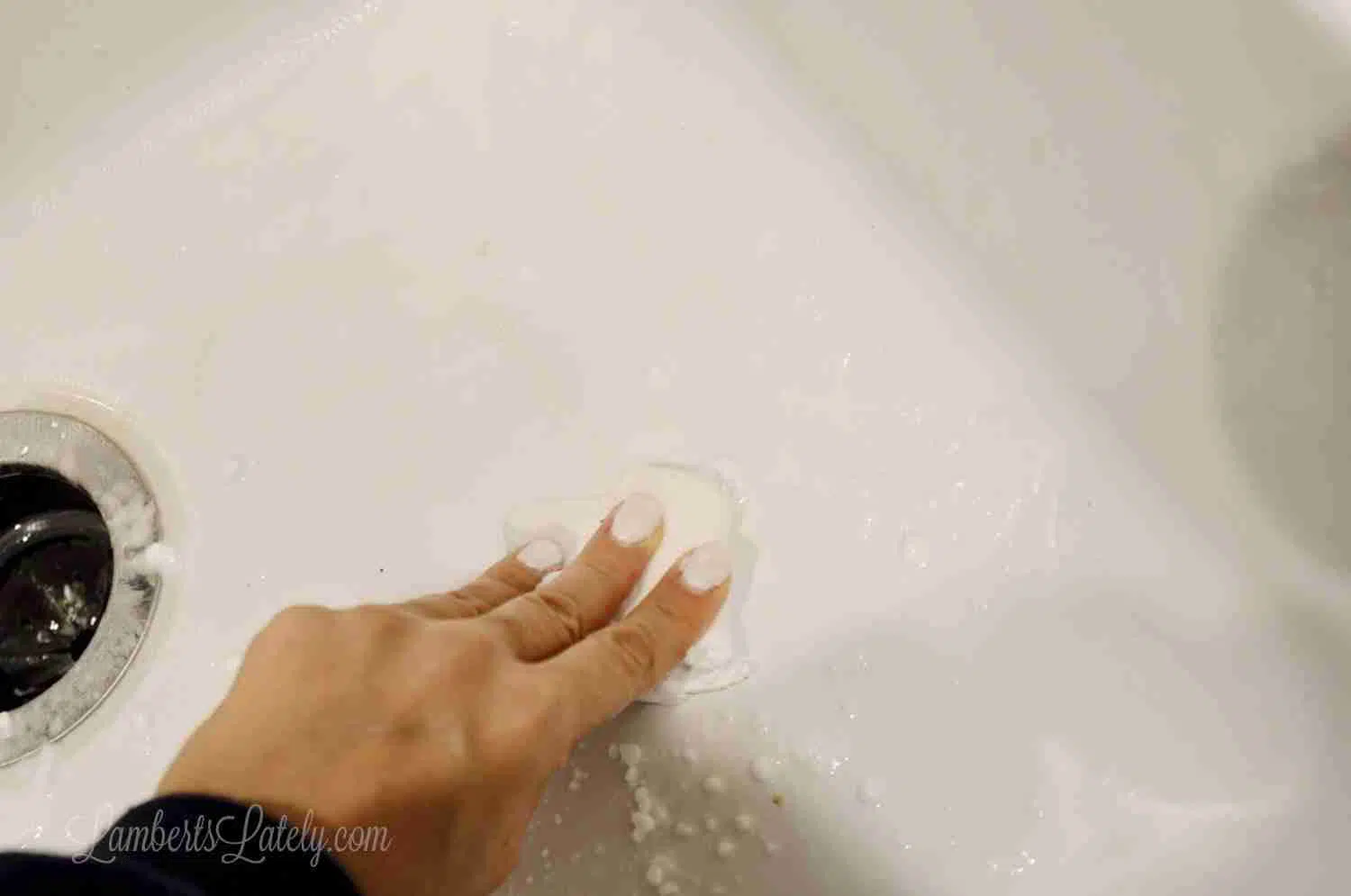 wiping sink with melamine sponge.