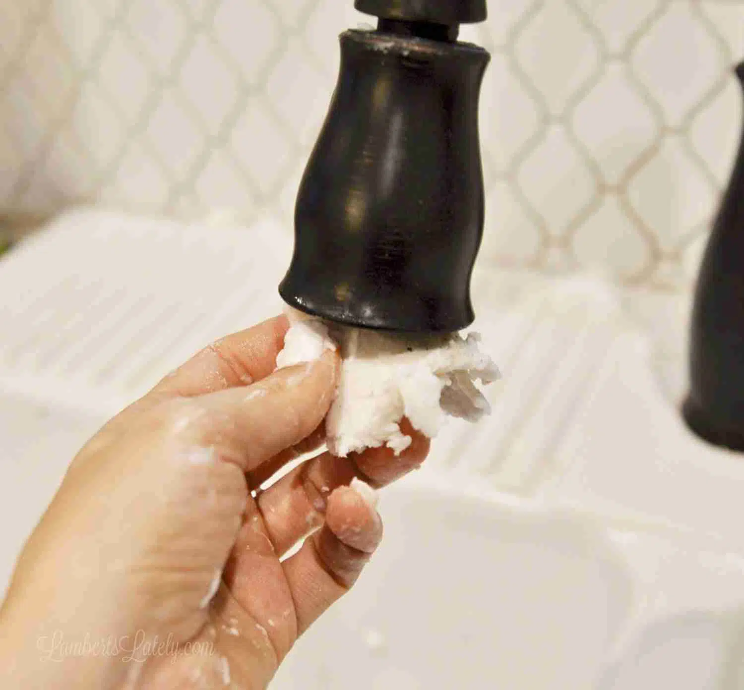 wiping faucet with melamine sponge.