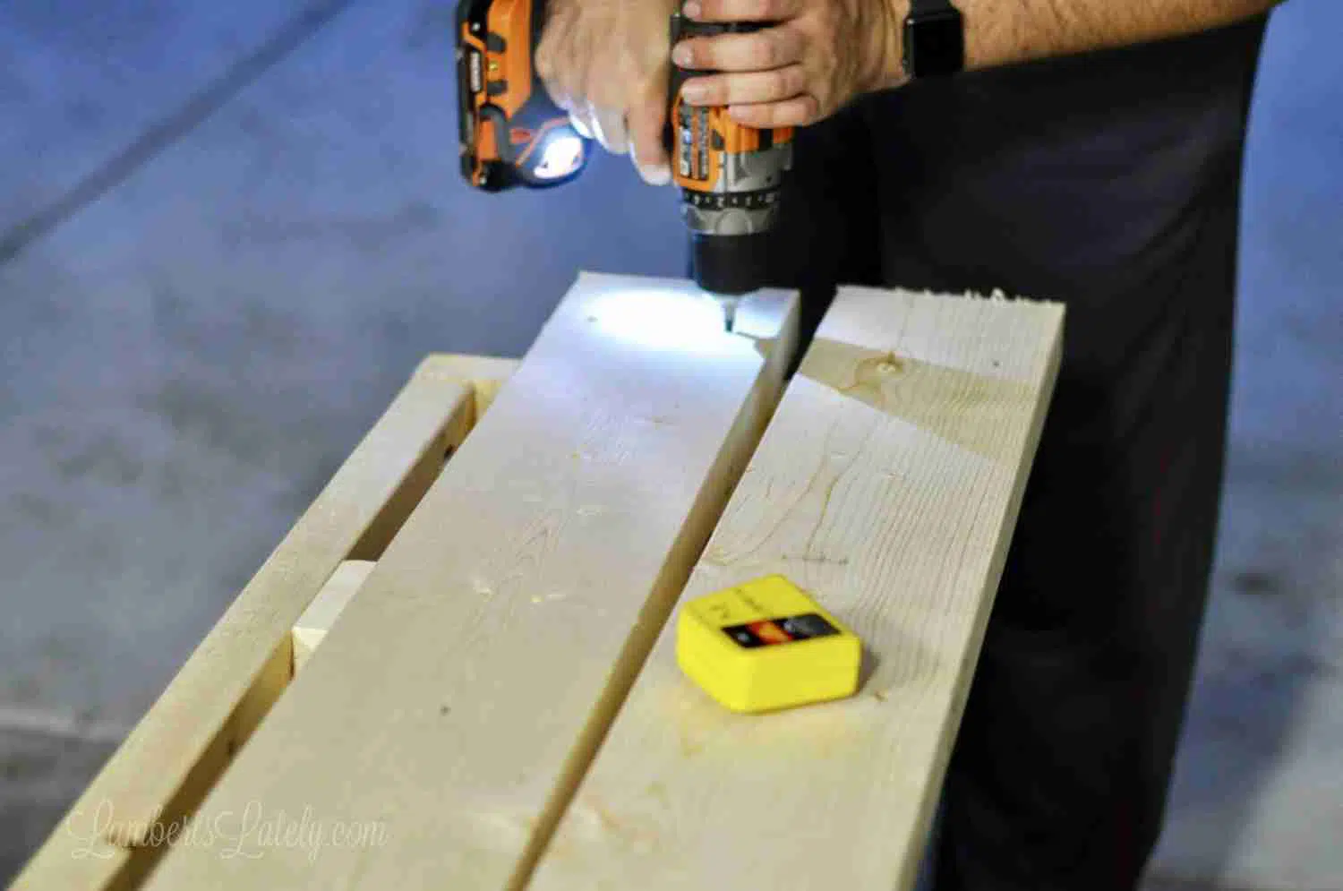 drilling a hole into a 2x4.