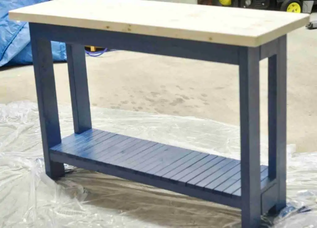 table legs painted blue, wood top not stained.