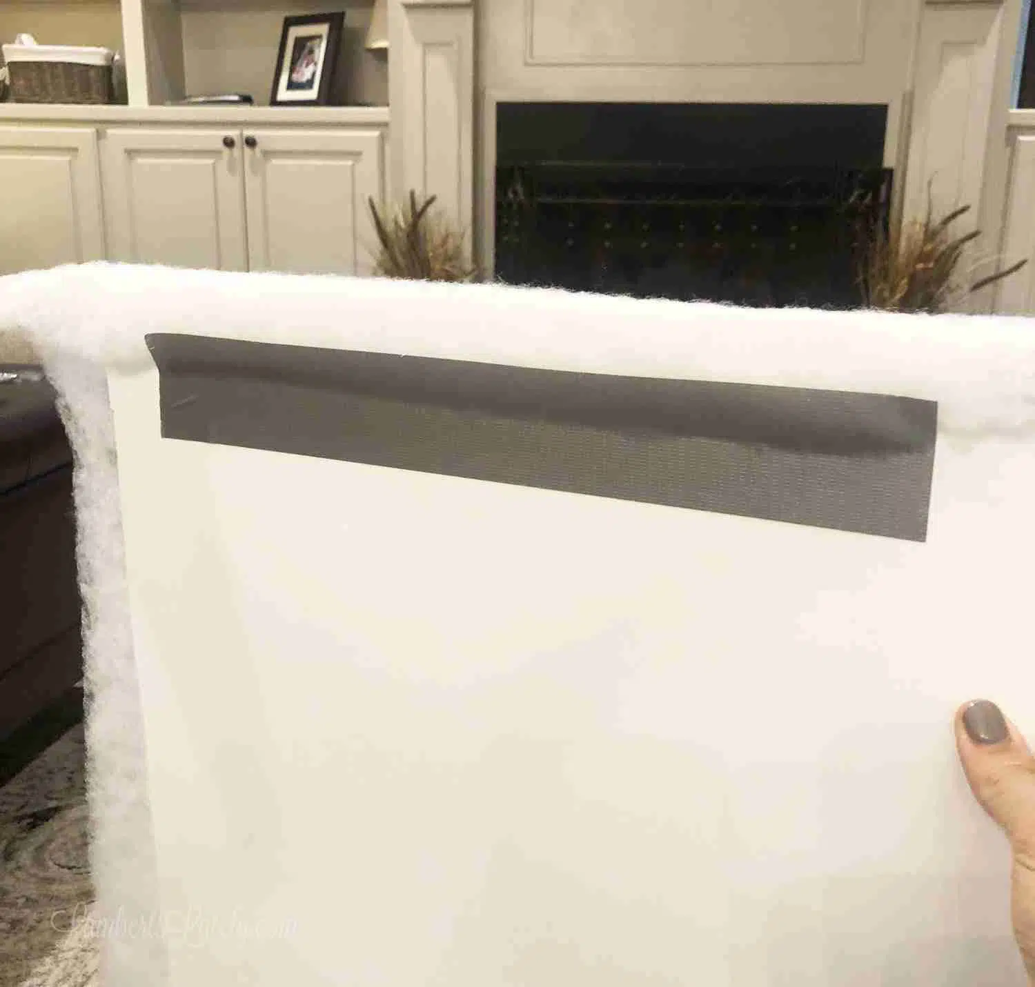fabric duct taped onto a frame.
