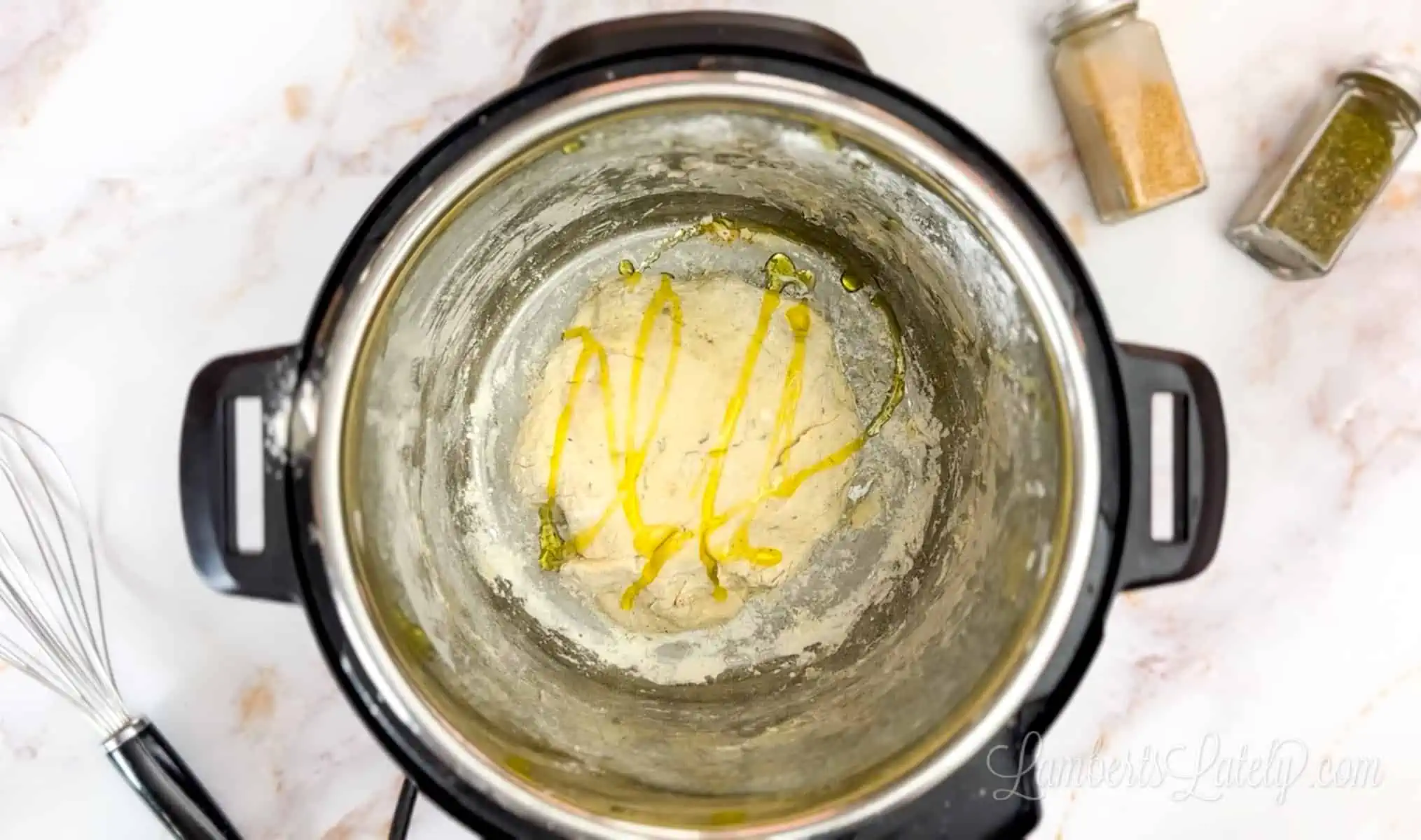 oil poured over ball of dough in an instant pot.