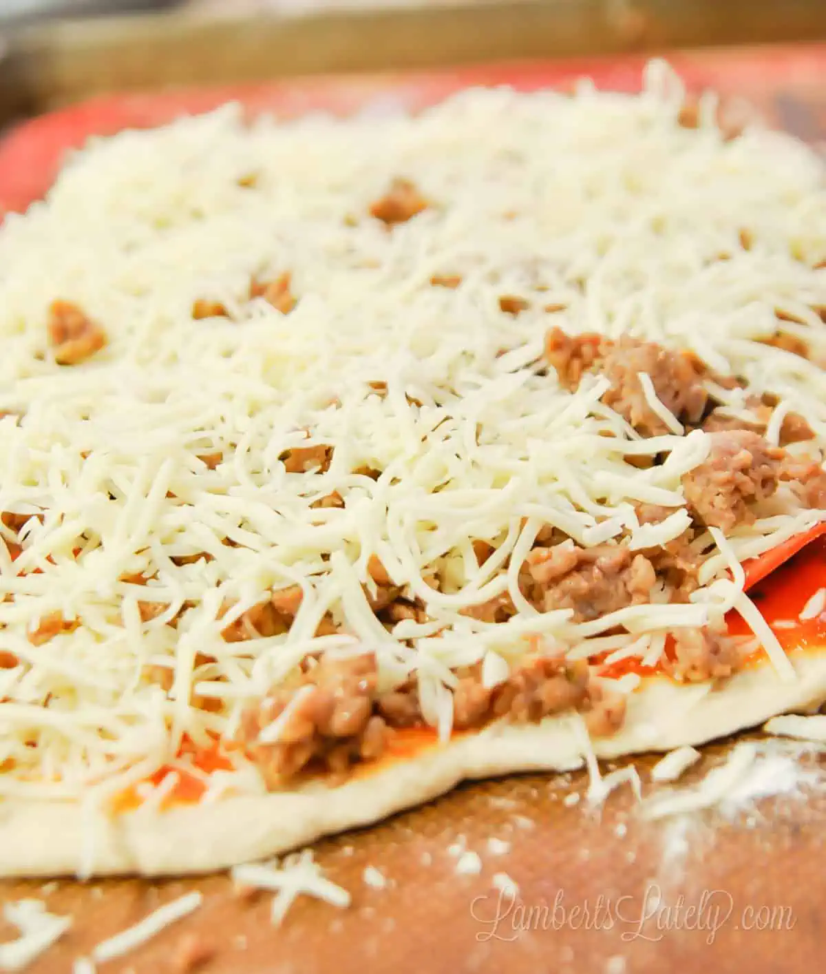 toppings on pizza dough.