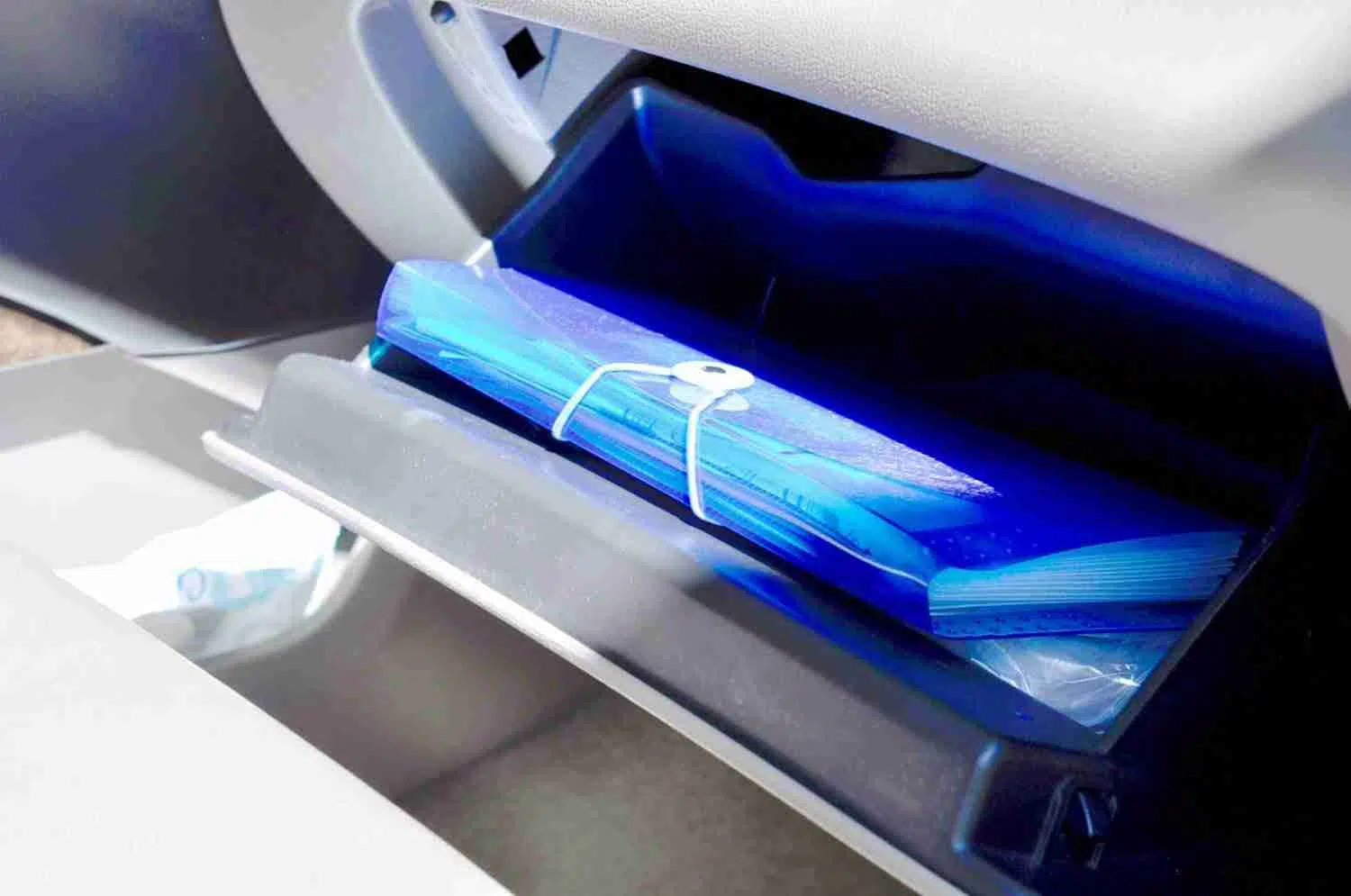 accordion file folder in a glove compartment.