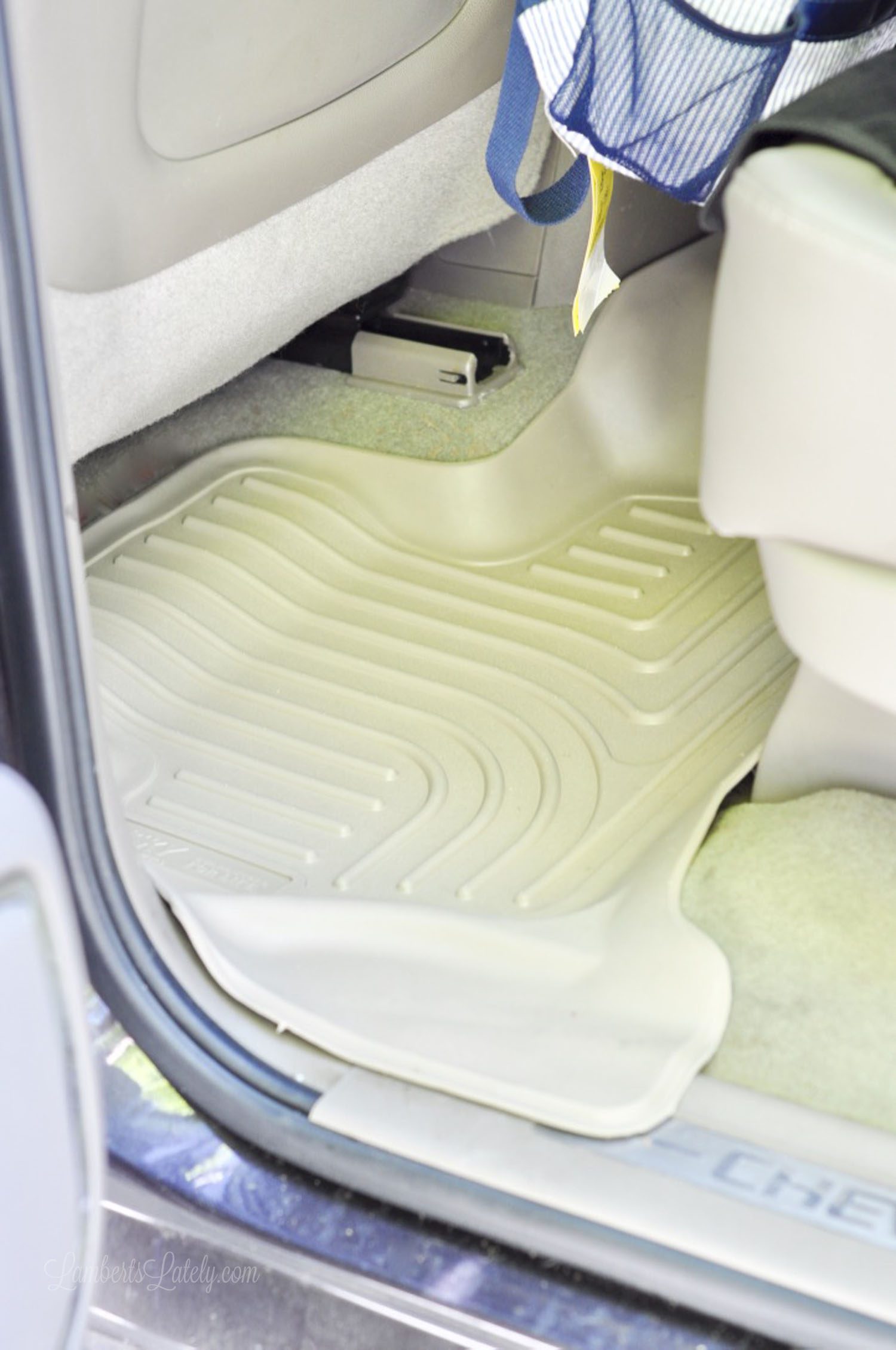 beige floor protector in the floor of a suburban.
