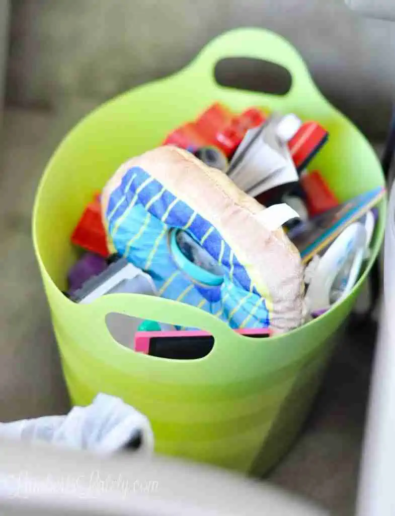 toys in a green bin.