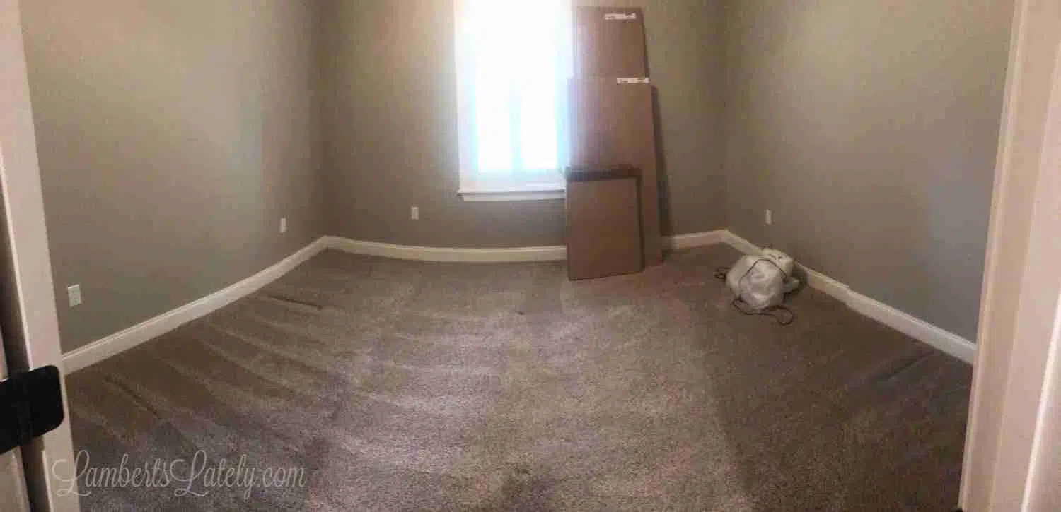 wide angle view of an empty bedroom
