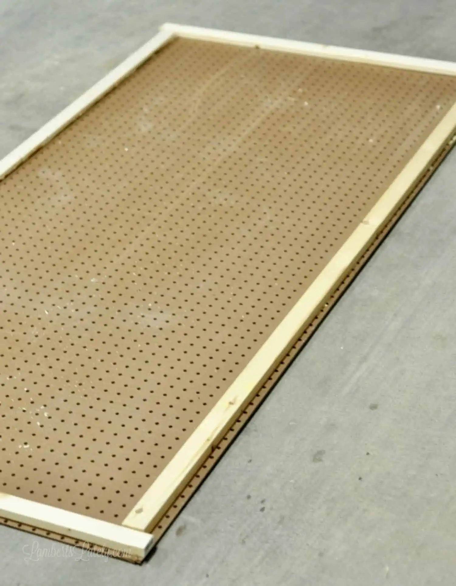 1 x 2 furring strips on back edges of pegboard.