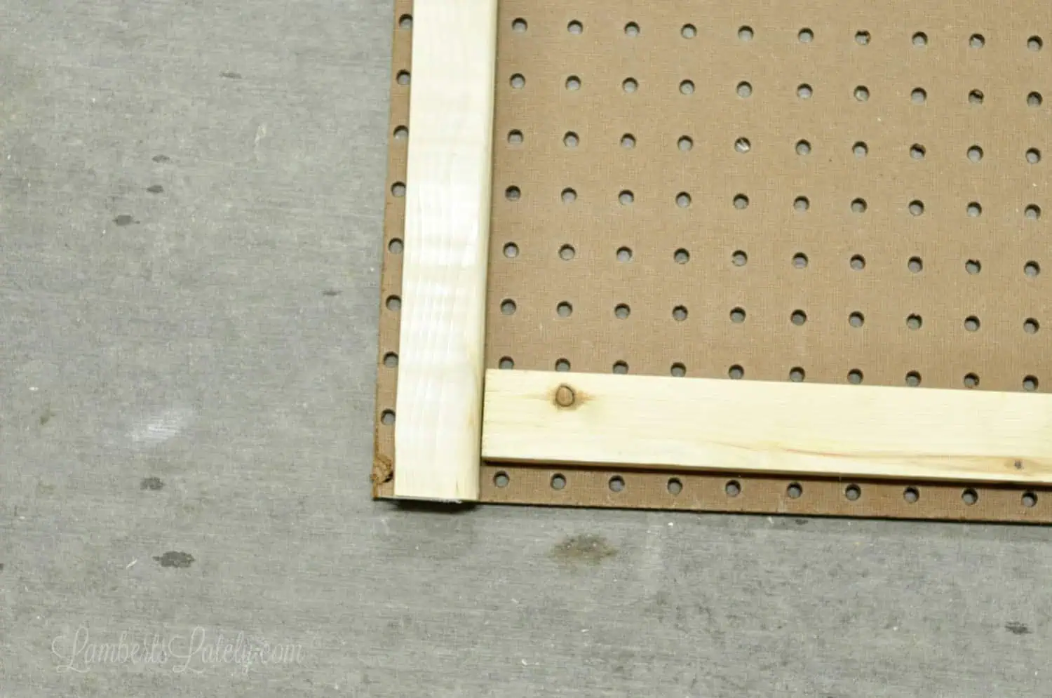 1 x 2 furring strips on back of pegboard.