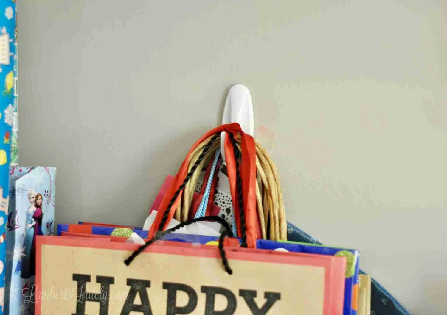 plastic peg holding gift bags on a wall