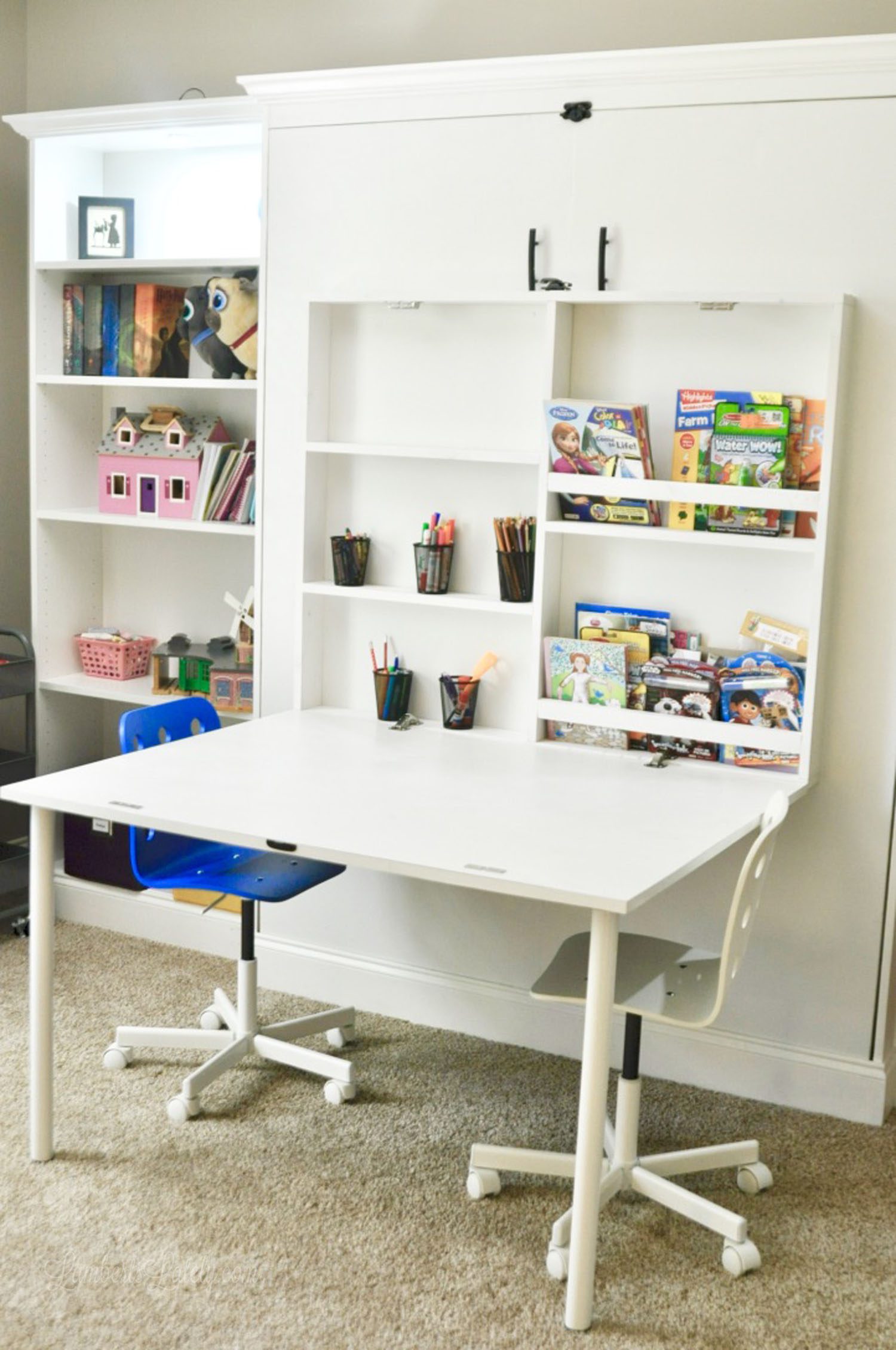 white murphy bed with desk installed on front
