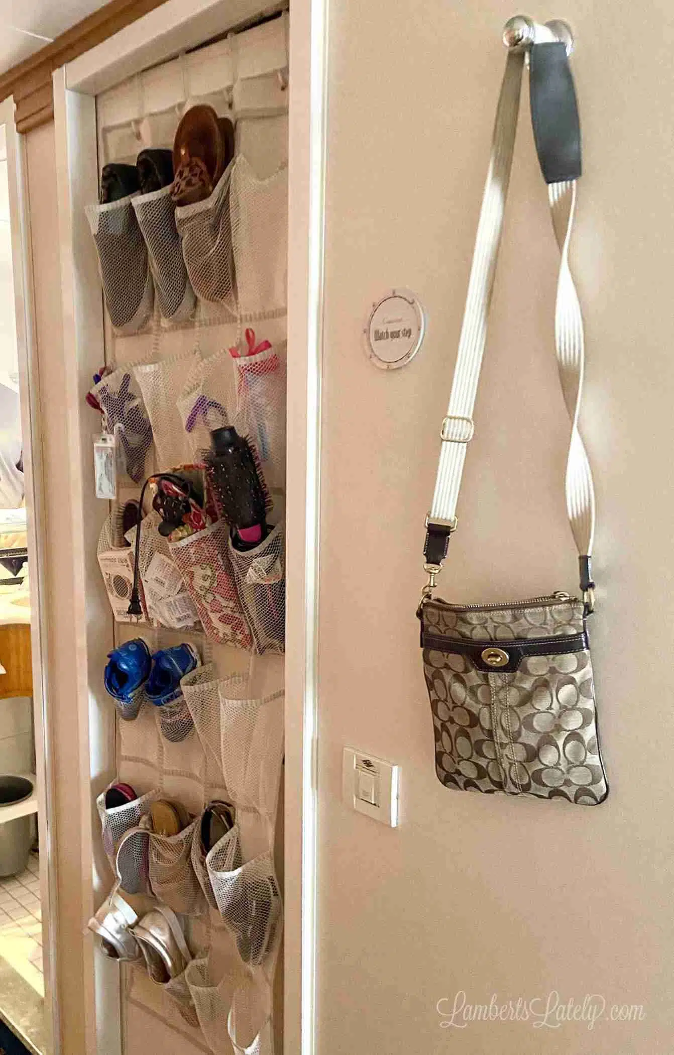 hanger holding a purse on a wall in a cabin.