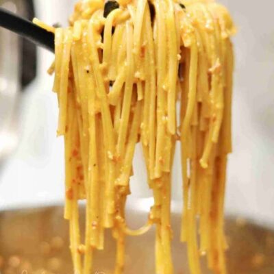 holding pasta in a spoon.