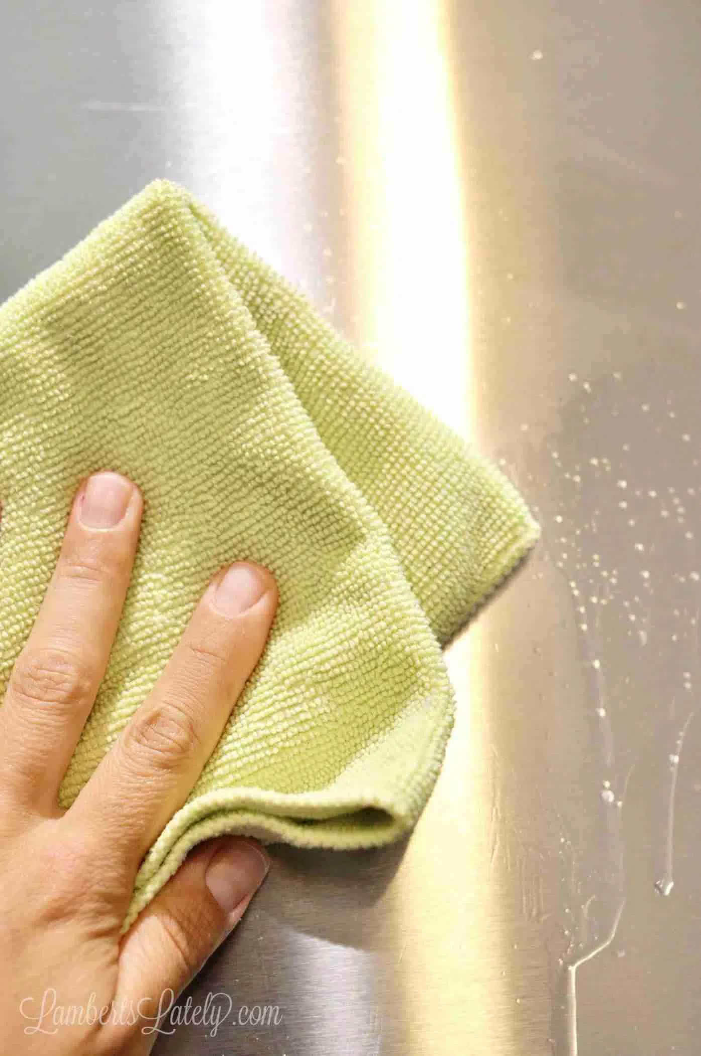 wiping stainless steel with a microfiber cloth