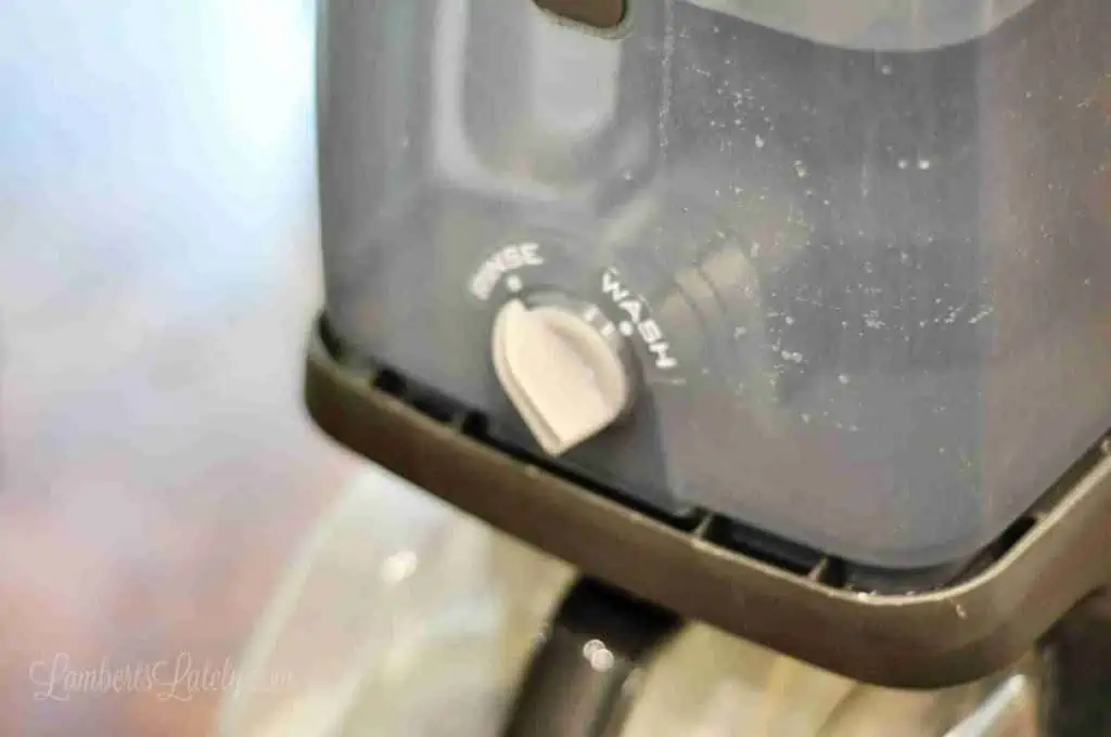 water tank of a carpet cleaner set to rinse.