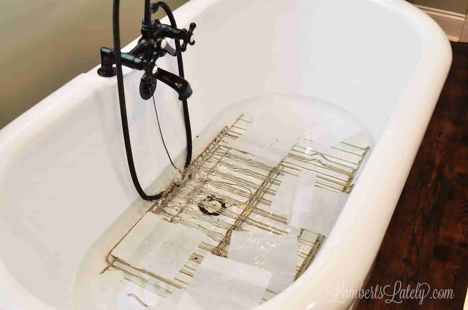 dryer sheets, hot water, and oven racks cleaning in a bathtub