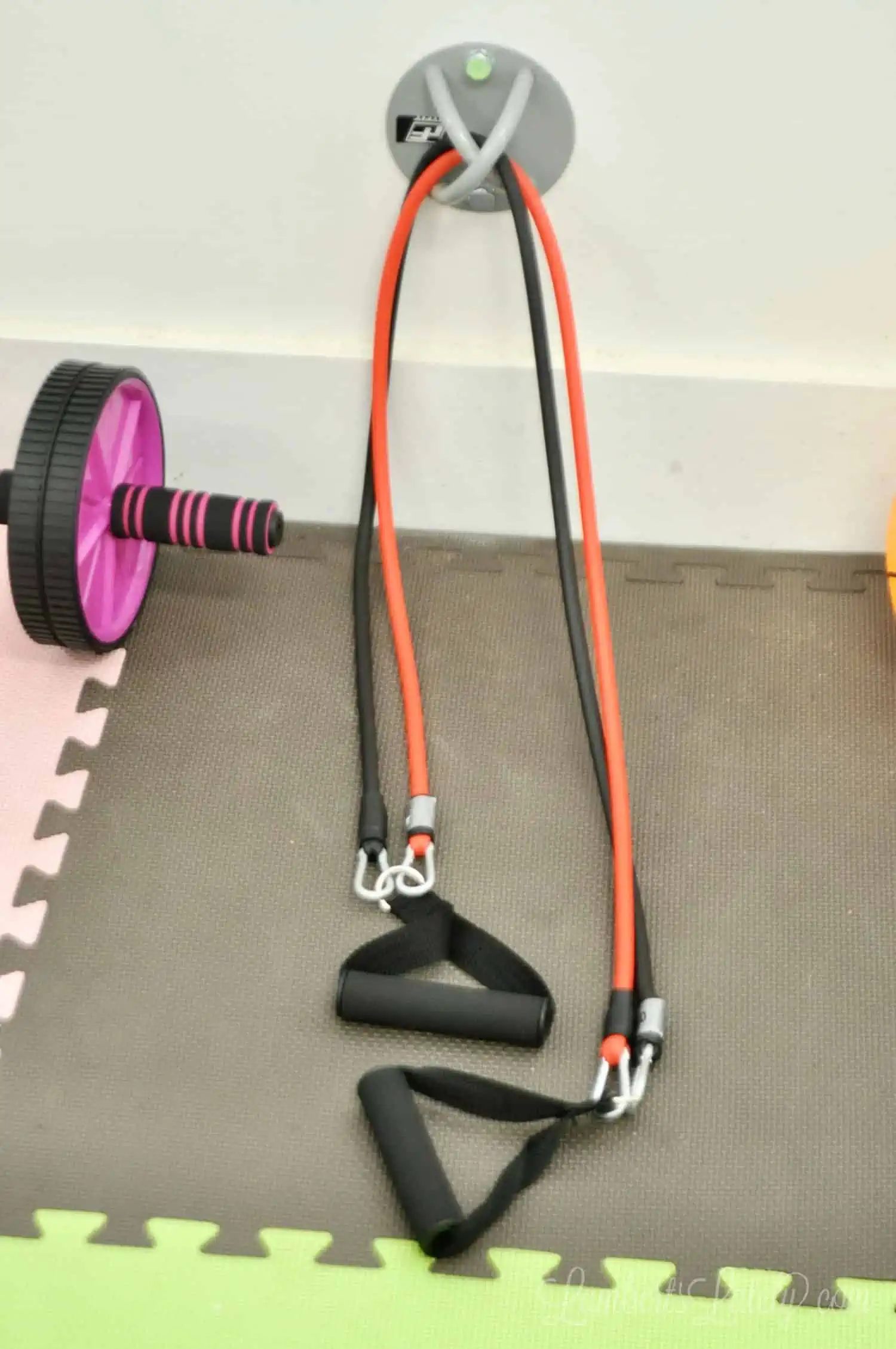 resistance bands being used in a home gym.