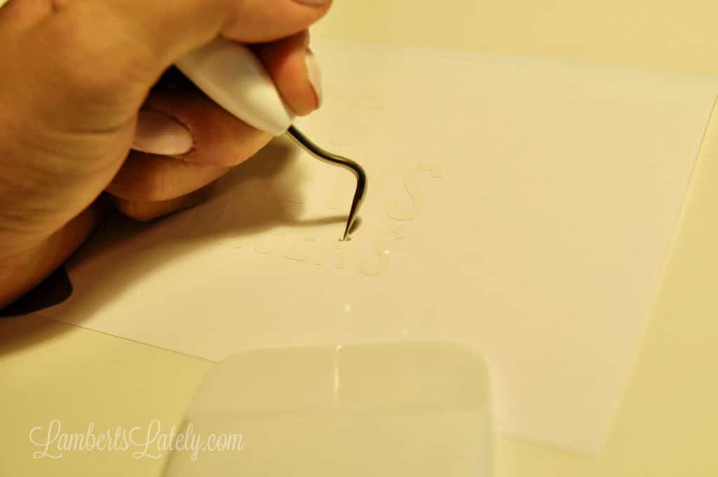 using weeding tool to remove small pieces of vinyl