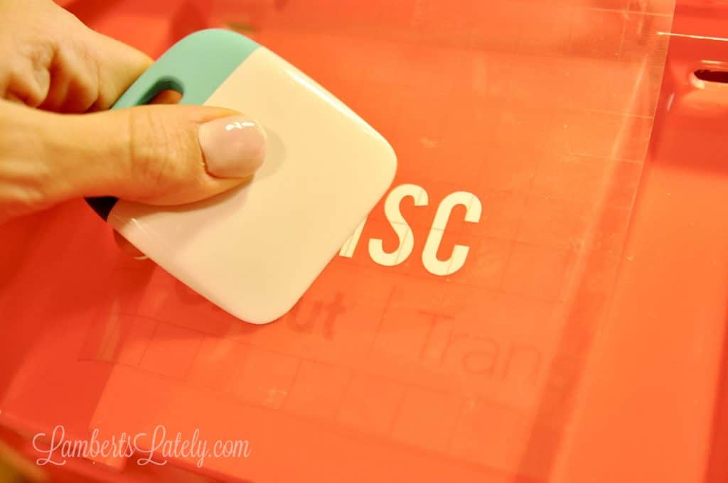 smoothing label on a plastic bin