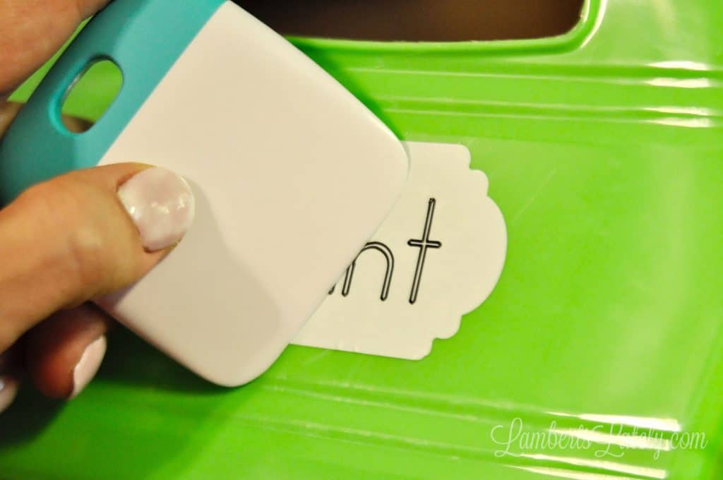 smoothing label on a plastic container