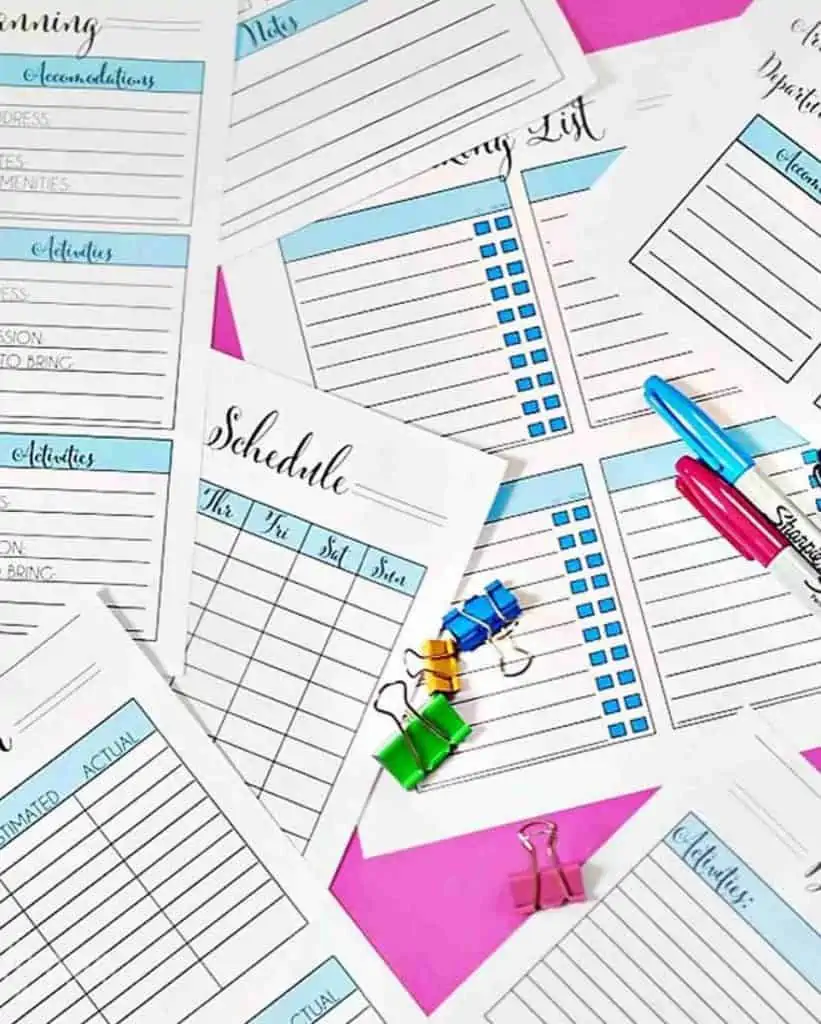 printables scattered on a pink background.