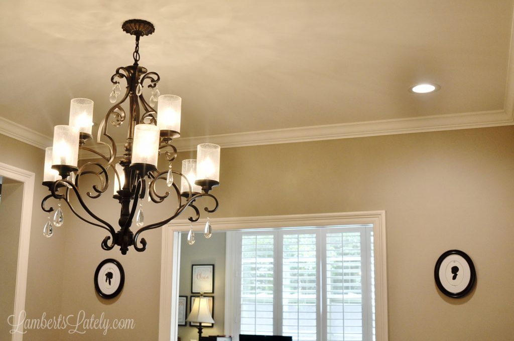 Check out this easy DIY for making existing crown molding look thick! Simply installing additional trim molding and using a faux painting trick makes simple molding look expensive.