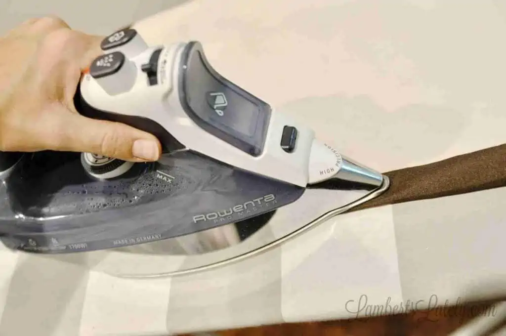 ironing hem of curtain.