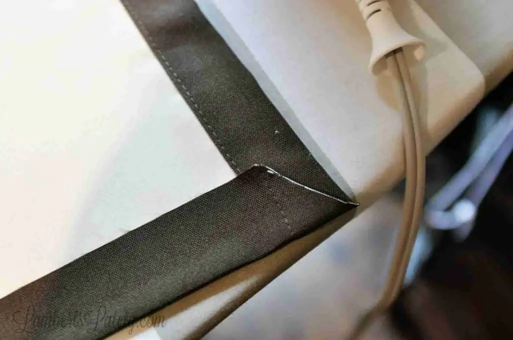 diagonally cut corner of the back of the curtain.