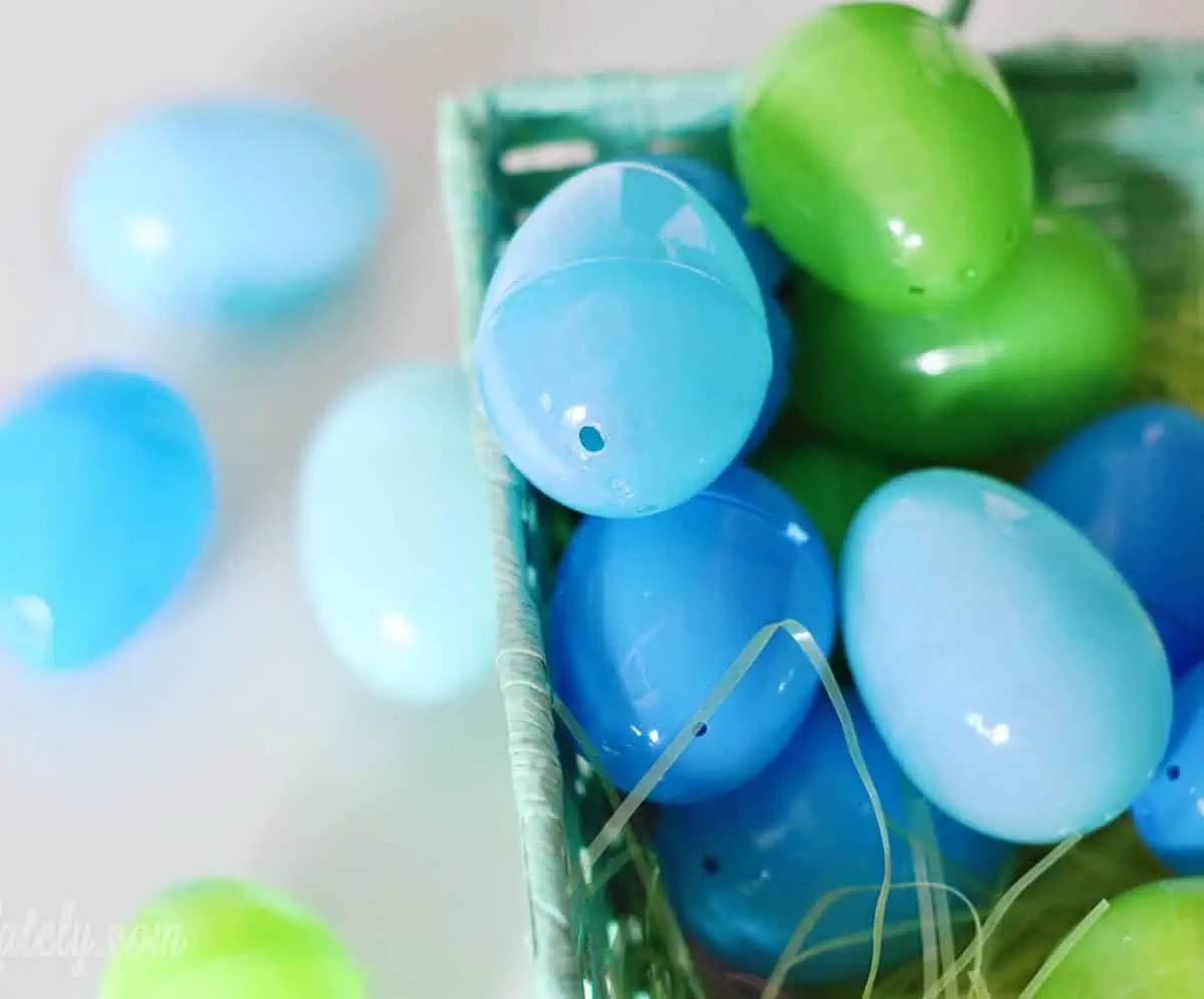 blue and green plastic easter eggs on a counter.