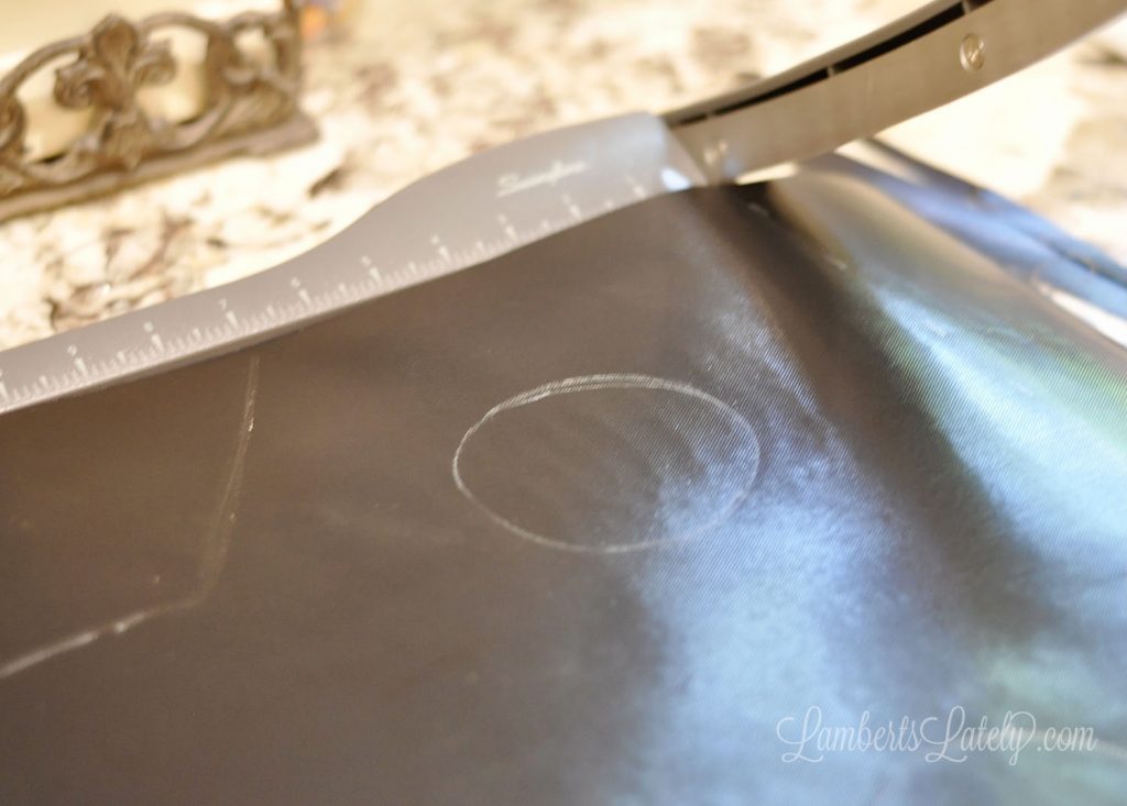 cutting oven liner with a straight edge paper cutter